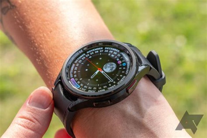 Samsung Galaxy Watch Active 2 A Samsung Galaxy Watch Active 2 rests on a light, wooden surface.