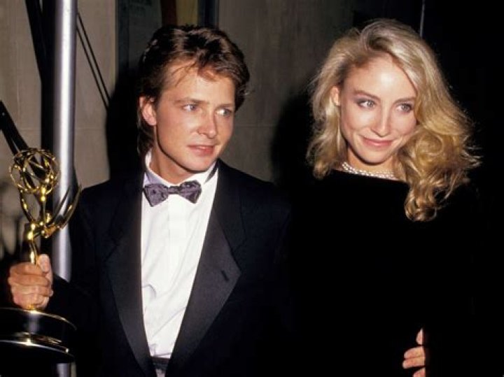 Michael J. Fox and Tracy Pollan posing for a photo