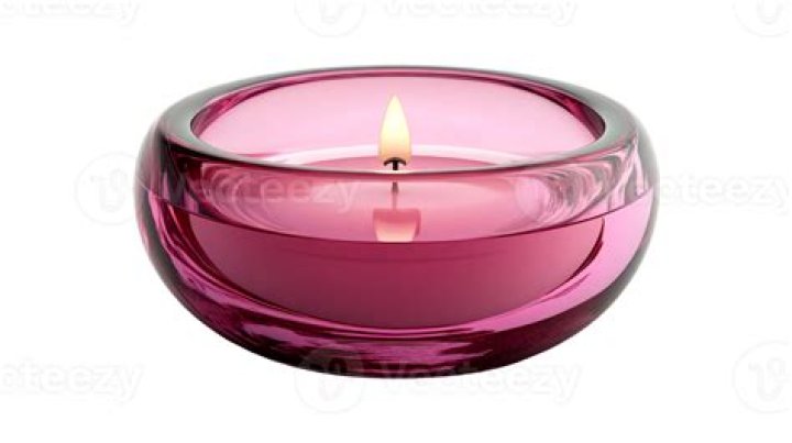 Pink candle with burning flame during a love spell or healing spell