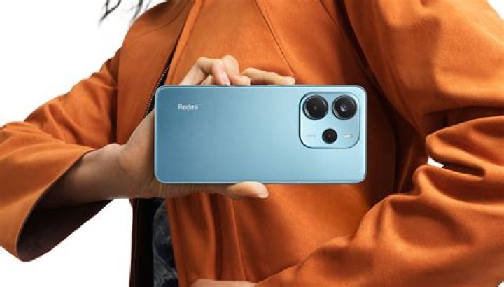 Redmi Note 8 in hand with display on