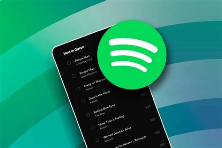 Spotify menu on a smartphone in a person's hand Spotify menu on a smartphone in a person's hand